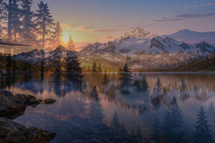Blended result showing the mountain lake and sunrise forest together at 50 percent opacity